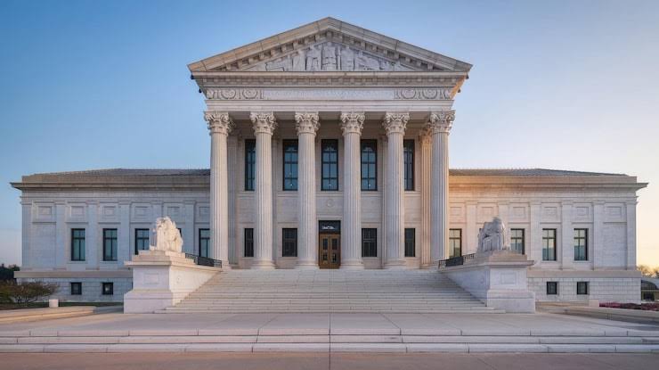 A plain court building exterior, or a laptop with a form open
