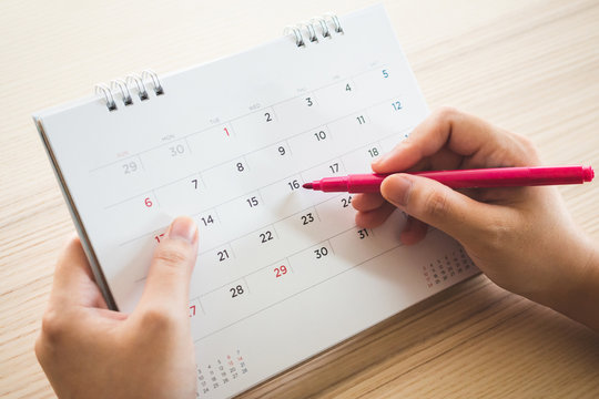 A calendar page with a pen