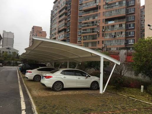 A residential car park with marked parking bays